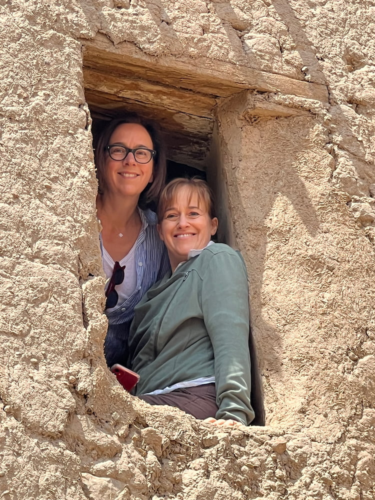 two people in a window frame