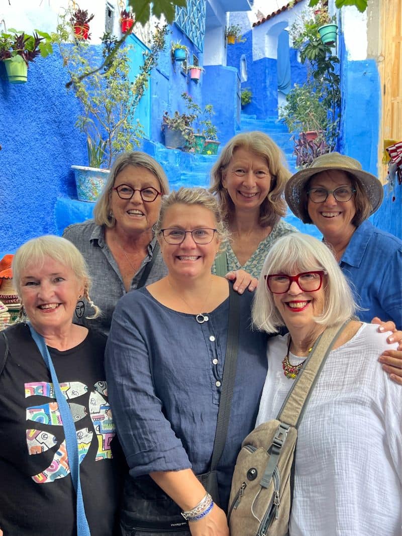 6 ladies standing in blue alley