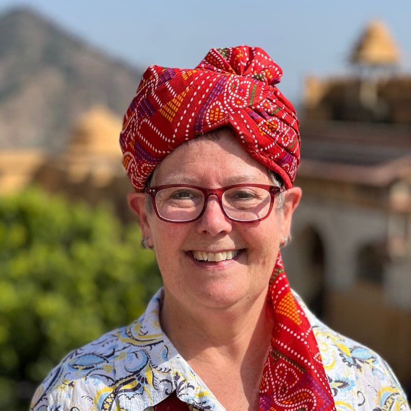 tourist with red turban on her head