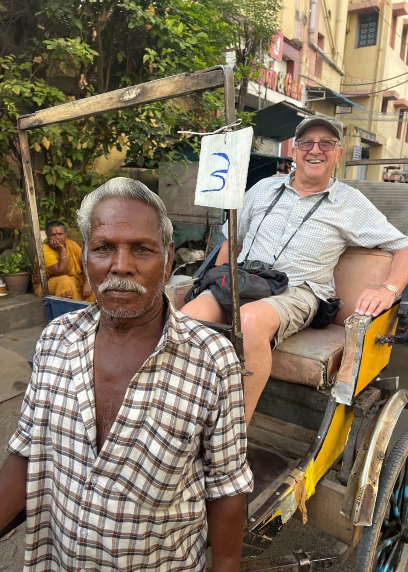lady wearing sari holding handwoven bag